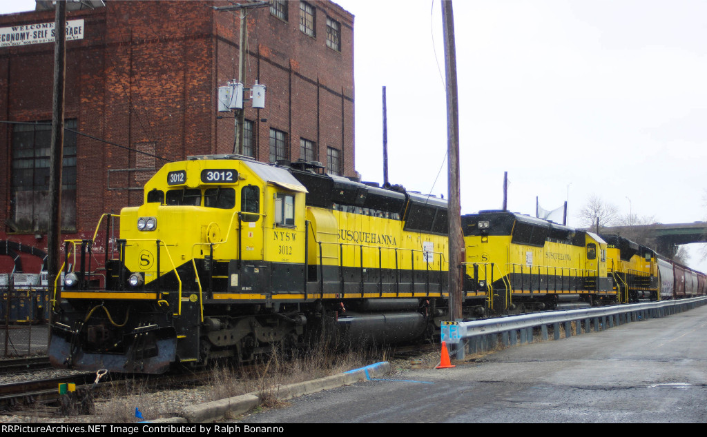 A trio of yellow jackets await its crew to depart west 